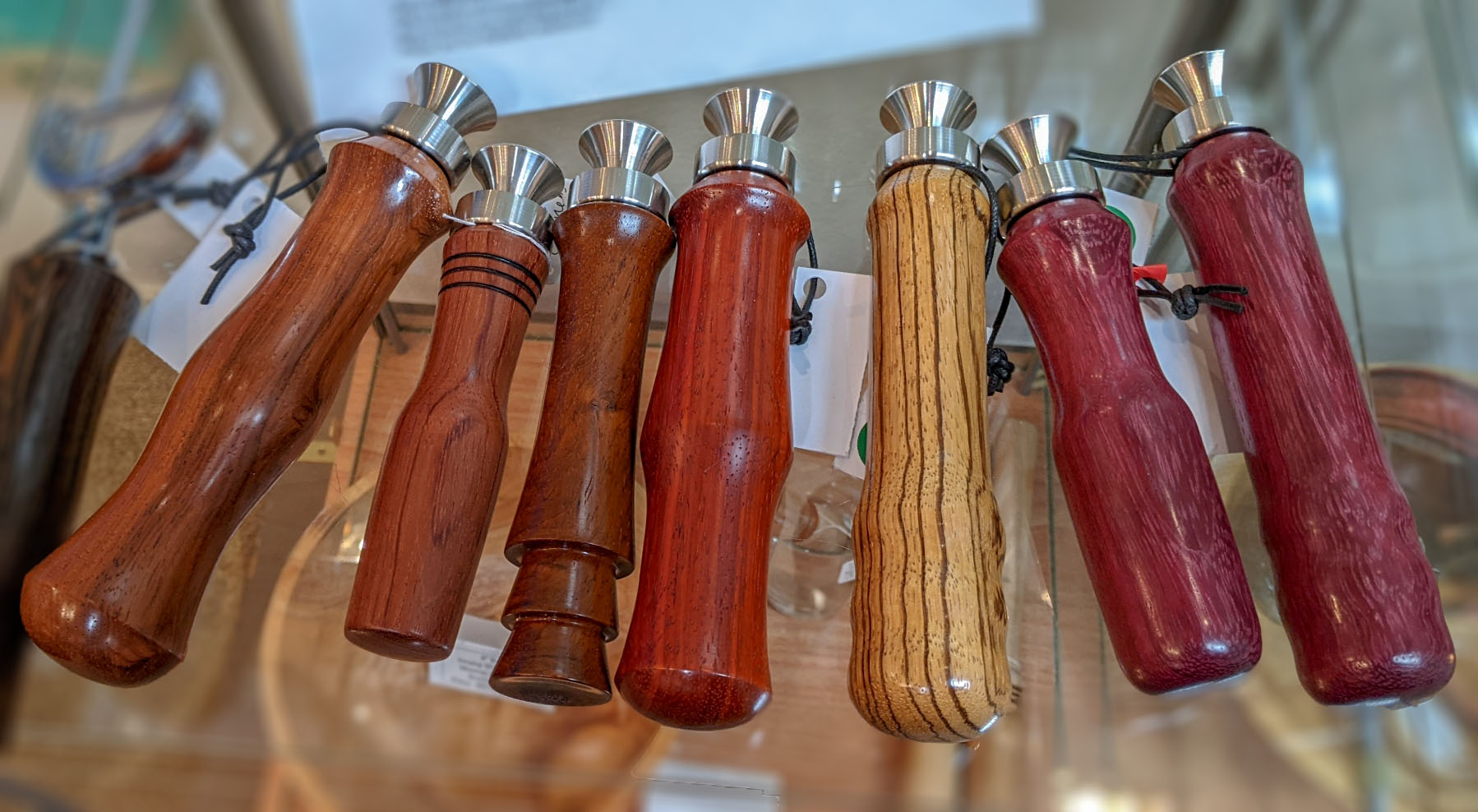Bottle Opener Collection 2: (#3) Honduran Rosewood - Far Left (#4) Bubinga (#5) Honduran Rosewood (#6) Padauk (#7) Zebrawood (#8+9) Purpleheart - Far Right