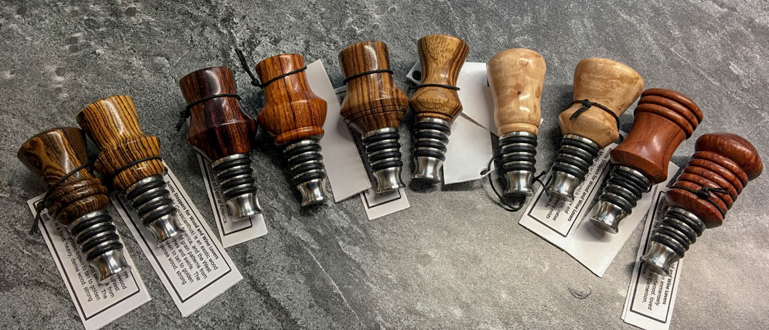 Array of Bottle Stoppers in Multiple Varieties of Wood